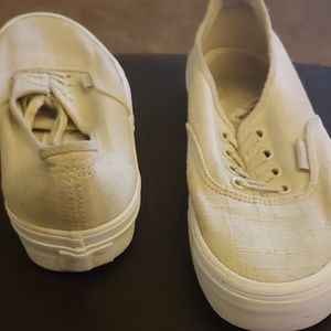 Cream colored Vans sneakers
